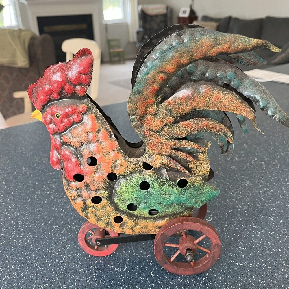 Metal Folk Art Rooster Tea Candle Holder  With 3 moving wheels.